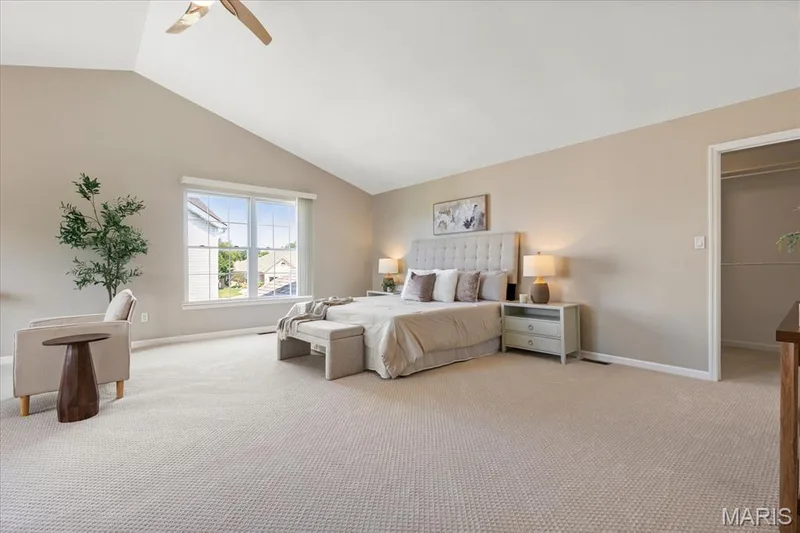 Unwind in the grand primary suite, where soaring vaulted ceilings and sunlit windows create a peaceful end-of-day retreat. This expansive primary suite also features a large sitting area and custom, large, walk-in closet. — 354 Buckington Street, St Peters, MO 63376