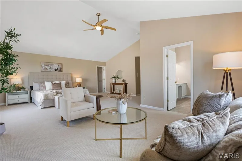 Alternate view of the primary bedroom demonstrating the open floor plan, sitting area space, and flows effortlessly into the spa-like en-suite bathroom. — 354 Buckington Street, St Peters, MO 63376
