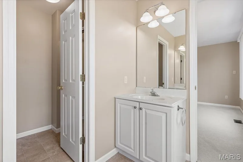 Another view of the Jack-and-Jill secondary bathroom with the separate room for the toilet and shower. — 354 Buckington Street, St Peters, MO 63376