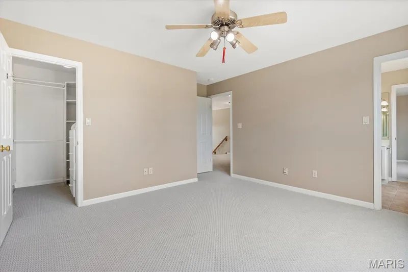Peek into the additional bedroom walk-in closet with built-ins. — 354 Buckington Street, St Peters, MO 63376