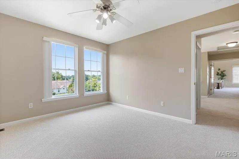 Additional bedroom layout framed by dual windows with elevated views, soft and hallway connectivity. — 354 Buckington Street, St Peters, MO 63376