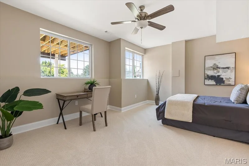 Guests will feel right at home in this private lower-level bedroom suite fitted with comfortable study and lounge areas. — 354 Buckington Street, St Peters, MO 63376