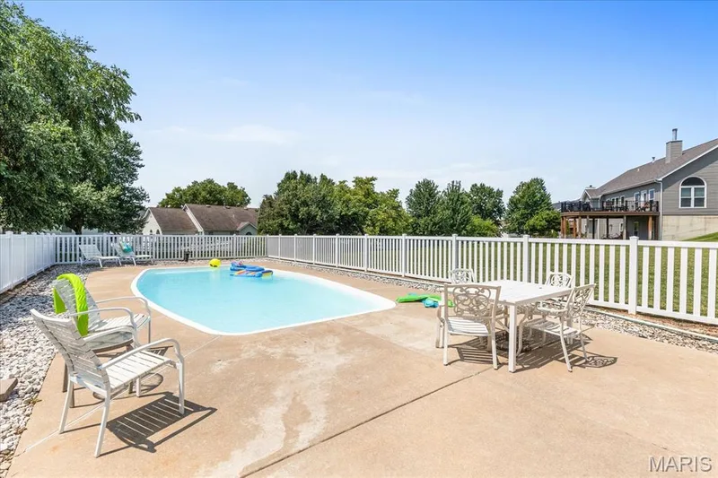 Spend sunny summer afternoons lounging by the water or dining al fresco on the wide concrete pool deck. — 354 Buckington Street, St Peters, MO 63376