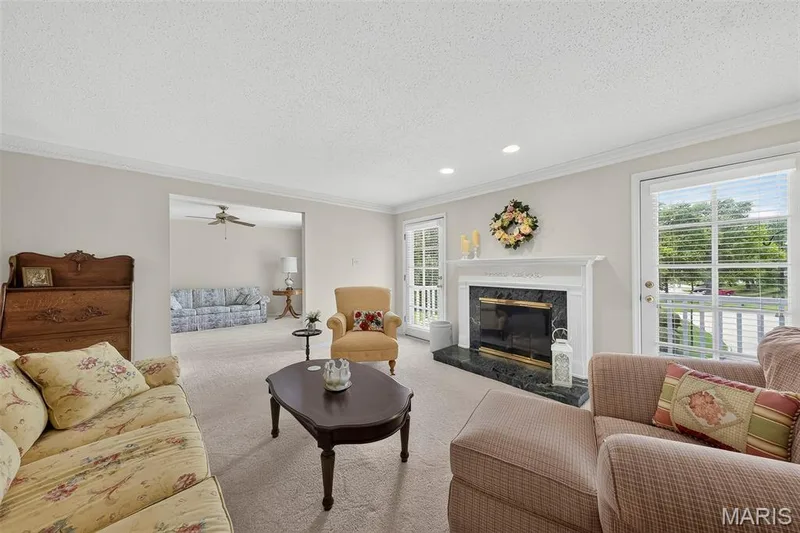 Living Room with Gas Fireplace and View of Den — 1530 Bedford Forge Court #15, Chesterfield, MO 63017