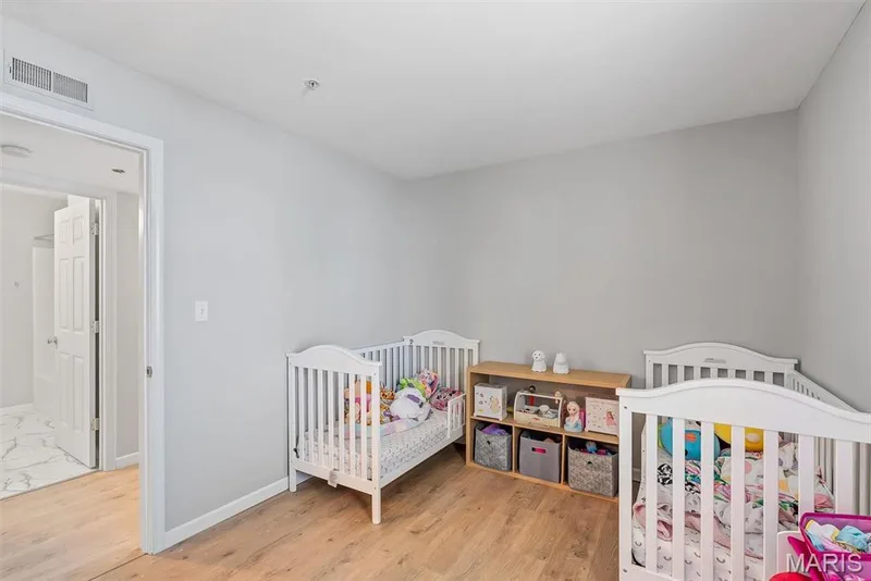 Room featuring light wood-finish flooring, light gray walls, and recessed lighting — 640 Homerun Drive #37N, O'Fallon, MO 63366