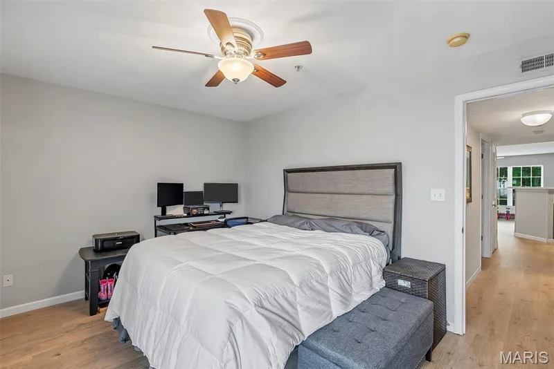 Bedroom featuring light wood-finish flooring and neutral wall tones — 640 Homerun Drive #37N, O'Fallon, MO 63366