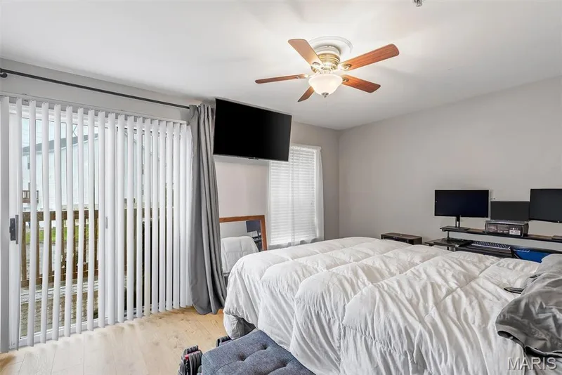 Light wood-finish flooring complements the neutral wall color — 640 Homerun Drive #37N, O'Fallon, MO 63366