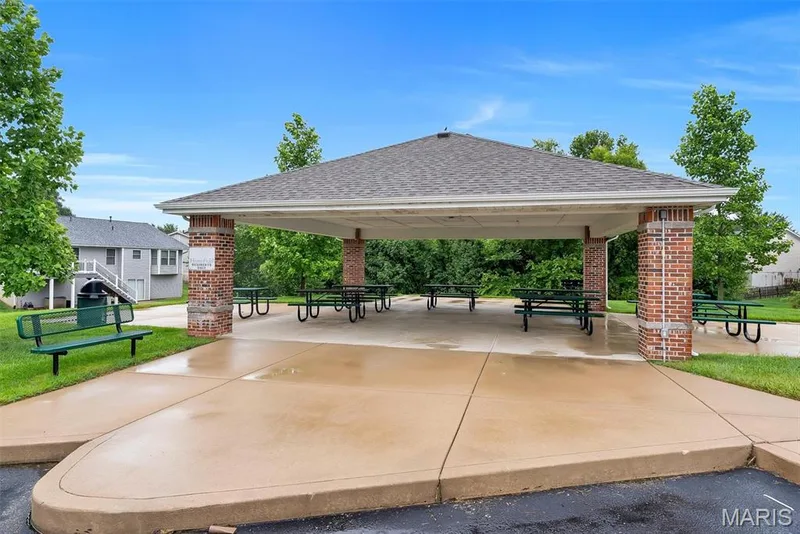Community pavilion featuring a shingle roof and brick pillars — 640 Homerun Drive #37N, O'Fallon, MO 63366