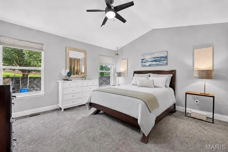 Vaulted ceilings, a ceiling fan, and plush carpet flooring — 708 Woodland Ridge Drive, St Peters, MO 63376