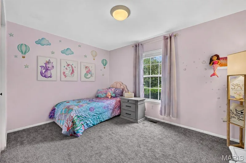 Wall-to-wall carpeting with a double-hung window and flush-mount ceiling light — 708 Woodland Ridge Drive, St Peters, MO 63376