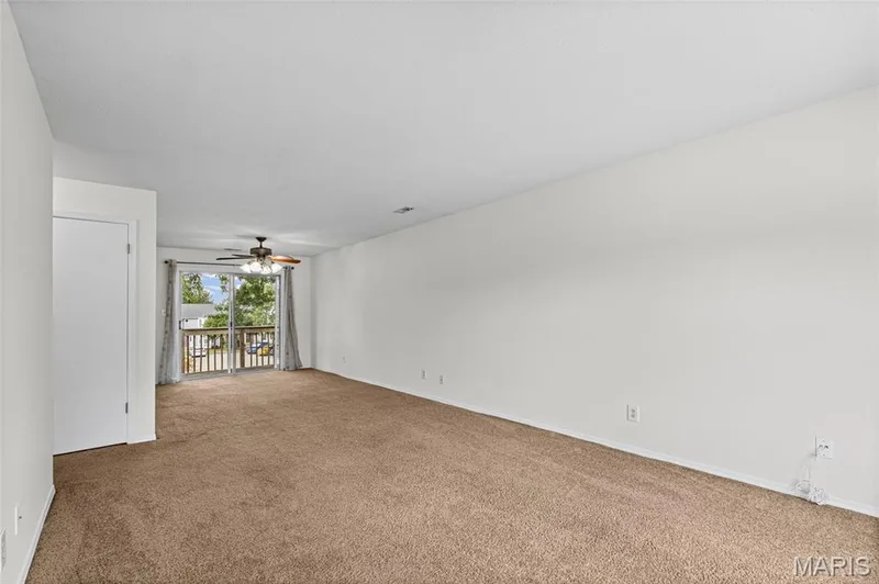 View of Living Room and Dining area located near the balcony. — 1774 Kircher Drive #C, St Charles, MO 63303