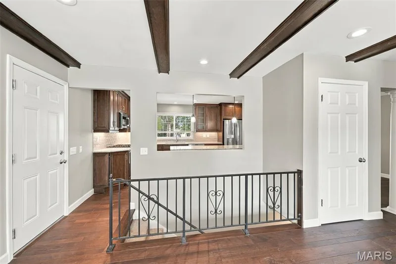 Family room features an open window into the kitchen — 1230 Luray Drive, Chesterfield, MO 63017
