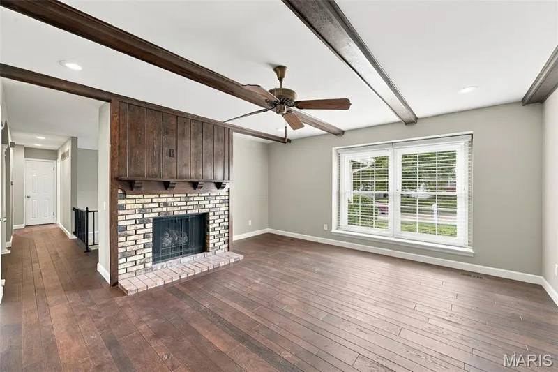 From it's hardwood floors, to it's gas fireplace, this room will quickly become your comfort zone — 1230 Luray Drive, Chesterfield, MO 63017