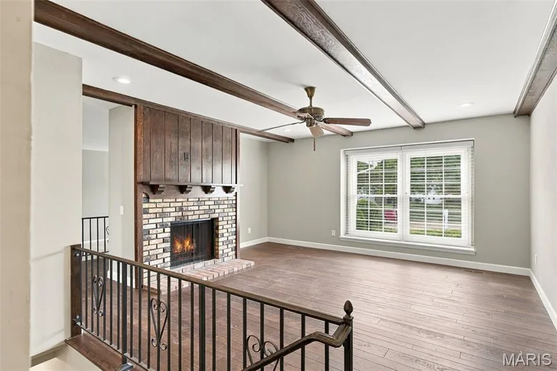 Imagine cozying up in front of the gas fireplace with a great book on a chilly day. — 1230 Luray Drive, Chesterfield, MO 63017