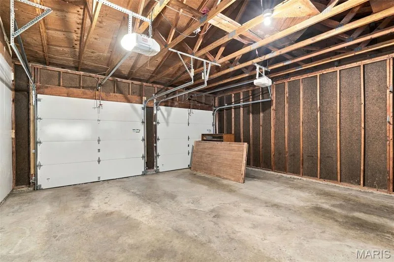 Oversized garage has plenty of storage space for lawnmower, bikes, and more! — 1230 Luray Drive, Chesterfield, MO 63017