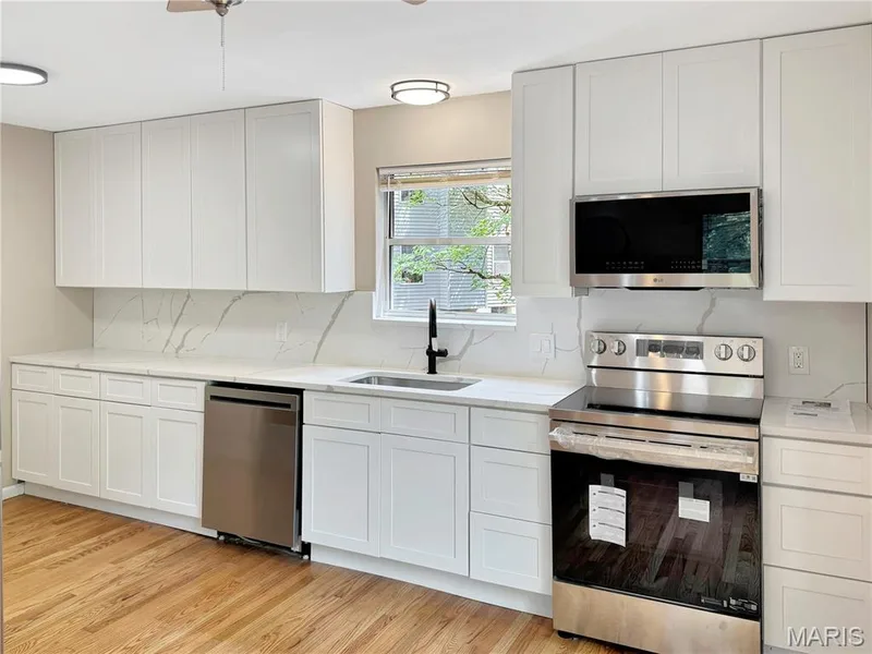 Beautiful new cabinets, quartz countertops, backsplash, and new appliances. — 6 Whispering Rock Court, O'Fallon, MO 63366