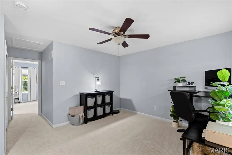 Carpeted room with light gray walls and a ceiling fan — 349 Shady Rock Lane, O'Fallon, MO 63368