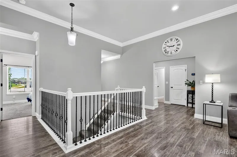Twist & baseket decorative black spindles on wide staircase to basement. — 826 Liberty Creek Drive, Wentzville, MO 63385