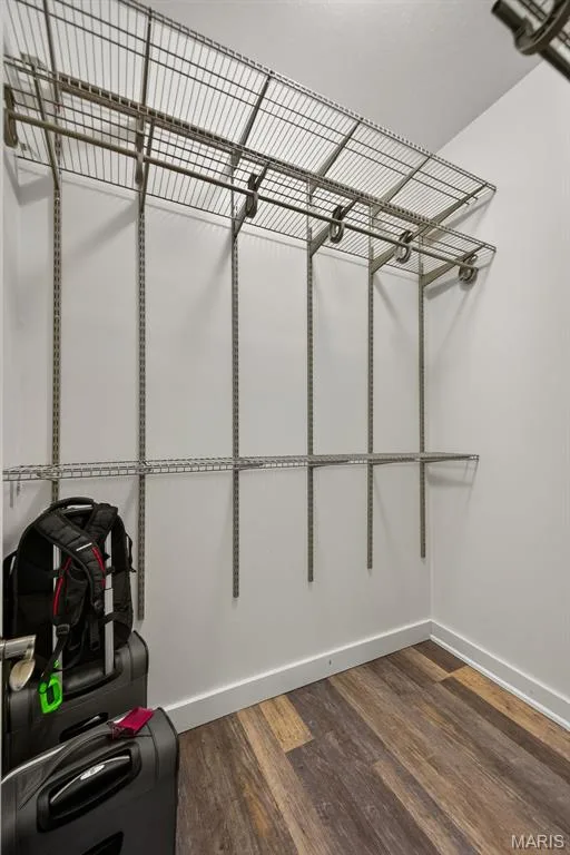 Dedicated storage room featuring industrial-grade wire shelving with multiple tiers and horizontal rod systems for hanging organization — 3471 Hiram Street, St Charles, MO 63301