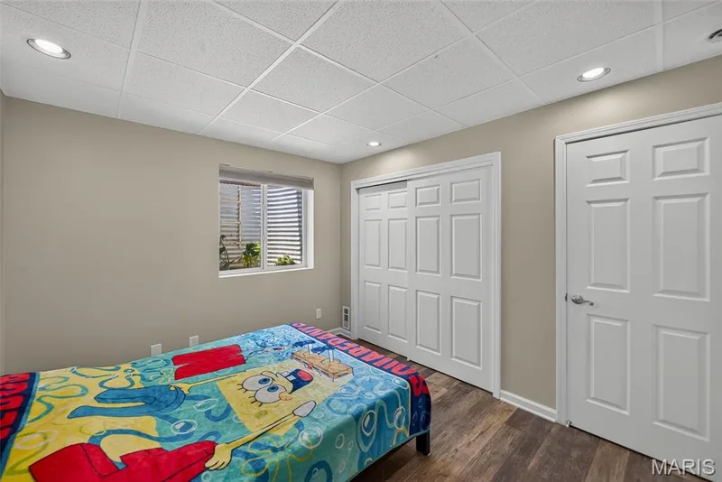 Room featuring recessed lighting, paneled doors, and wood-finish flooring — 3471 Hiram Street, St Charles, MO 63301