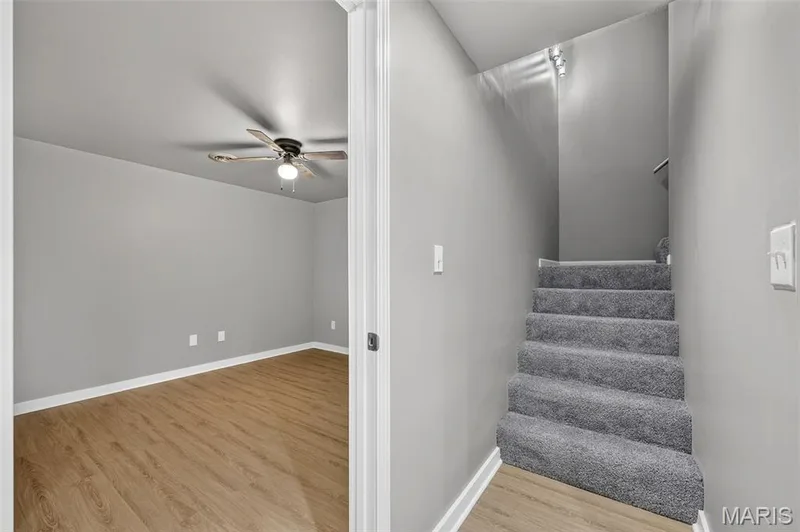 Gray walls complementing white trim and wood-finish flooring — 2947 Bromley Drive, O'Fallon, MO 63368