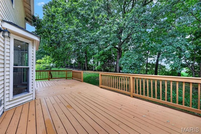 Expansive wood deck with a natural wood railing system — 2947 Bromley Drive, O'Fallon, MO 63368