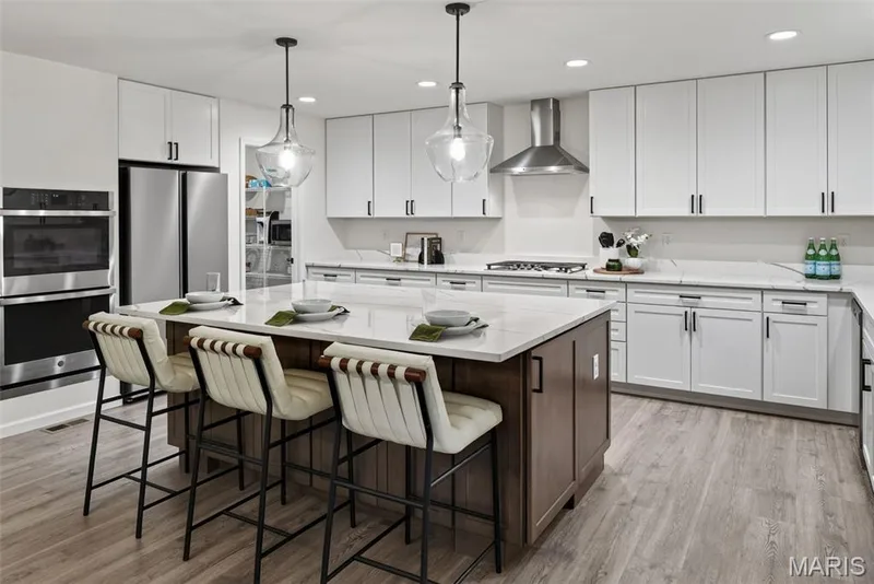 Clean 42' white shaker style cabinets with soft close doors and drawers — 310 Osprey Court, Lake St. Louis, MO 63367