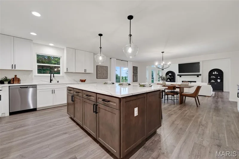 Modern expansive kitchen looking into breakfast and great room — 310 Osprey Court, Lake St. Louis, MO 63367