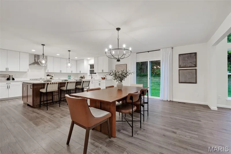 Breakfast room has classic wrought iron chandelier — 310 Osprey Court, Lake St. Louis, MO 63367