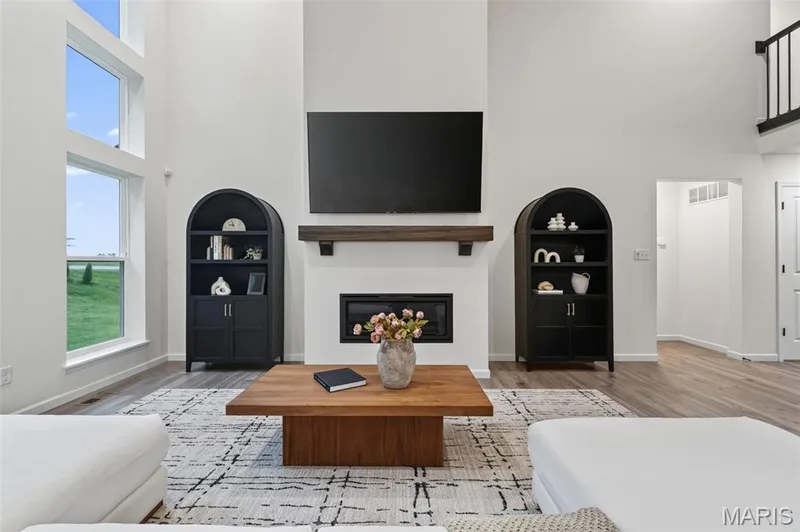Cozy and inviting great room fireplace — 310 Osprey Court, Lake St. Louis, MO 63367