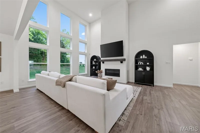 Grand view of 2 story floor to ceiling windows — 310 Osprey Court, Lake St. Louis, MO 63367