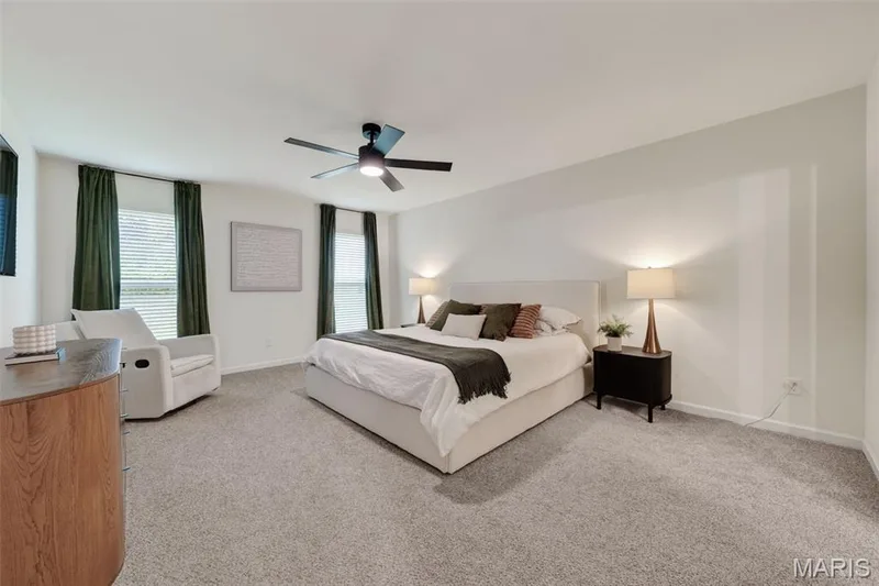 Relaxing main floor primary bedroom suite — 310 Osprey Court, Lake St. Louis, MO 63367