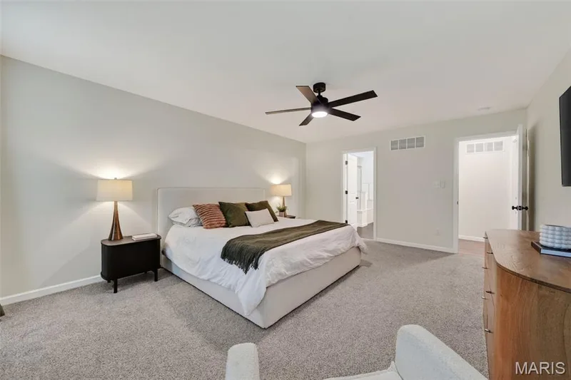 Spacious area to unwind at the end of the day, with a ceiling fan — 310 Osprey Court, Lake St. Louis, MO 63367