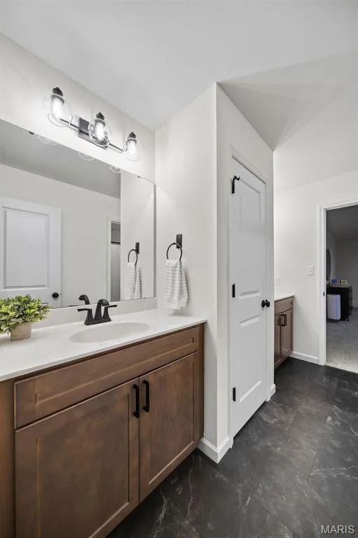 Private dual vanity sinks for each room to have it's own space, with linen closet for extra storage — 310 Osprey Court, Lake St. Louis, MO 63367
