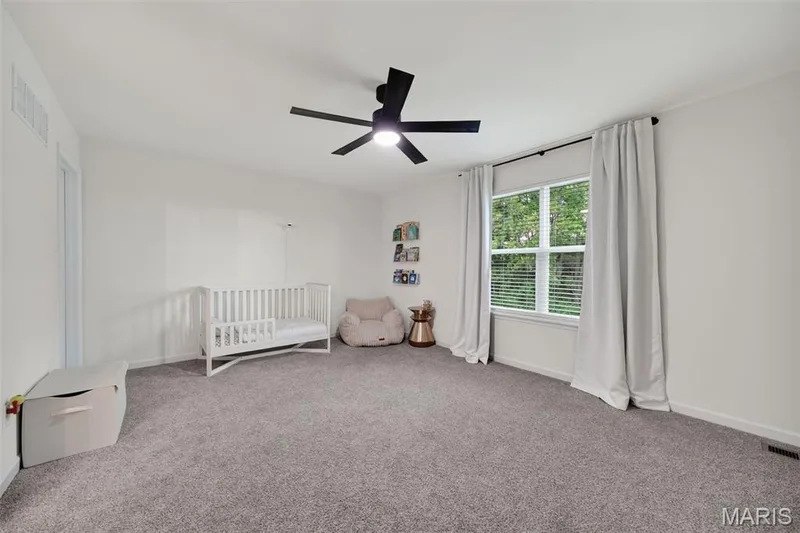 Bedroom #4 with walk in closet and ceiling fan — 310 Osprey Court, Lake St. Louis, MO 63367