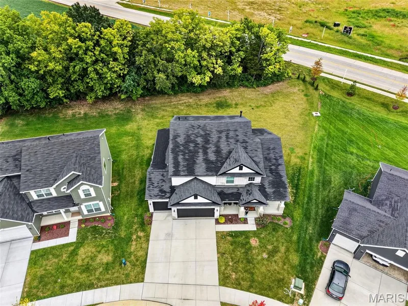 Quiet not-through street with views of pond from front porch — 310 Osprey Court, Lake St. Louis, MO 63367