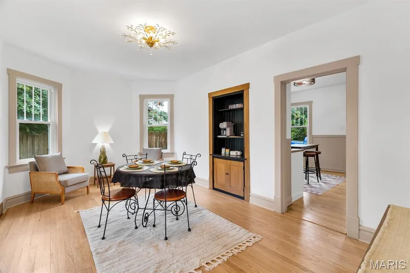 Dining room with restored, original built-in cabinet — 915 N Kingshighway Street, St Charles, MO 63301