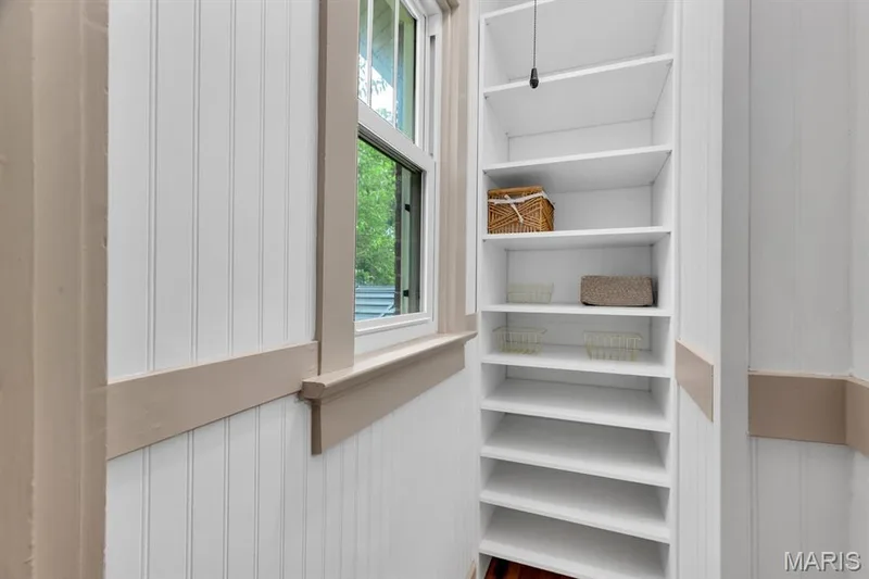 Walk-in pantry off kitchen with custom storage — 915 N Kingshighway Street, St Charles, MO 63301