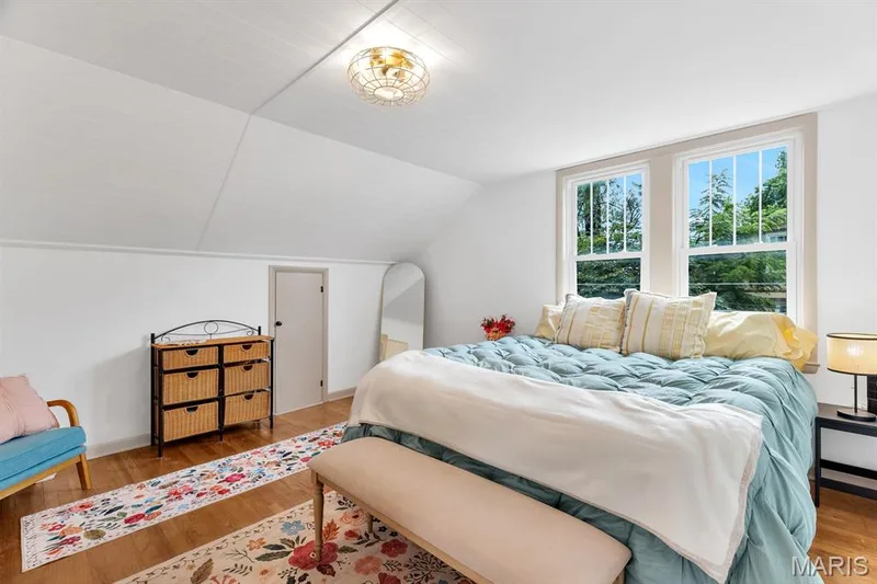 Master bedroom suite w/bathroom & walk-in closet with custom his & her storage.  Extra storage rooms located off Master suite.  Shiplap paneled ceiling — 915 N Kingshighway Street, St Charles, MO 63301