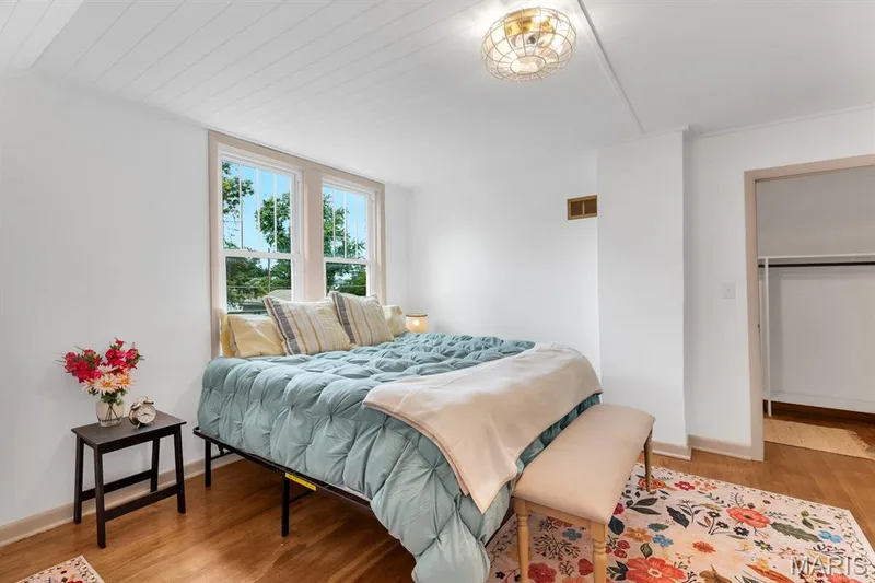 Master bedroom suite w/bathroom & walk-in closet with custom his & her storage.  Extra storage rooms located off Master suite.  Shiplap paneled ceiling — 915 N Kingshighway Street, St Charles, MO 63301
