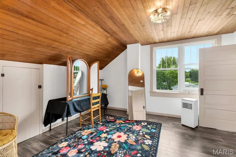 2nd bedroom on upper level staged as a dressing room.  Features a wood ceiling & walk-in closet with custom storage — 915 N Kingshighway Street, St Charles, MO 63301