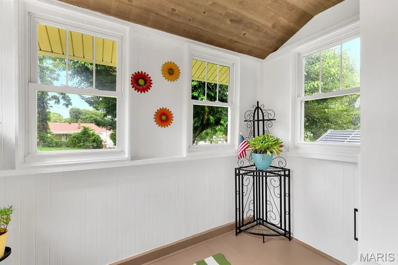 Mud room off kitchen with ceiling fan & custom storage/drop zone for shoes, coats, hats & kids sports equipment.  Access to the backyard & parking — 915 N Kingshighway Street, St Charles, MO 63301