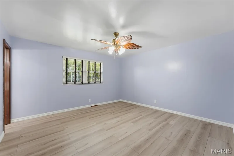 Bright interior space featuring light wood-finish flooring — 1613 Tamarack Drive, St Charles, MO 63301