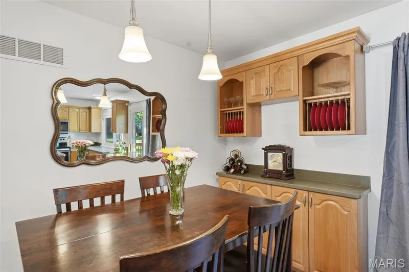 Dining area includes built-ins for extra storage and serving area. — 17 Oak Hill Lane, St Peters, MO 63376