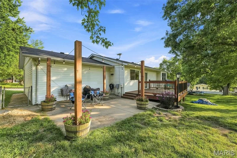 Back yard features a new deck and a patio...plenty of space for entertaining and family dinners! — 17 Oak Hill Lane, St Peters, MO 63376