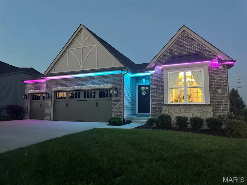 Brick and siding exterior featuring a prominent bay window with stone accents — 110 Alta Mira Court, Dardenne Prairie, MO 63368