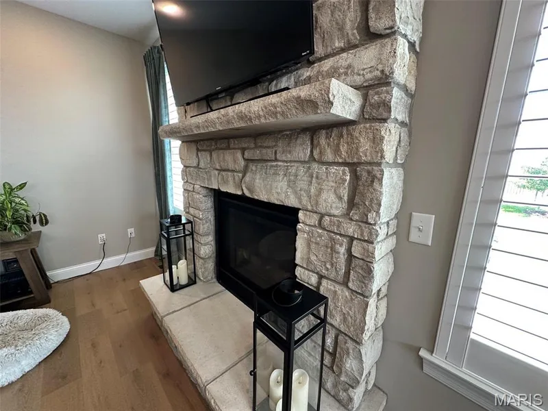 Stone-faced fireplace with a substantial stone mantle and hearth — 110 Alta Mira Court, Dardenne Prairie, MO 63368