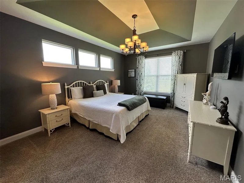 Tray ceiling with a central chandelier — 110 Alta Mira Court, Dardenne Prairie, MO 63368