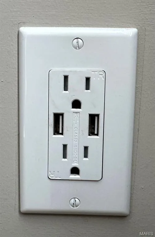 White wall outlet with two standard electrical receptacles and two integrated USB charging ports — 110 Alta Mira Court, Dardenne Prairie, MO 63368