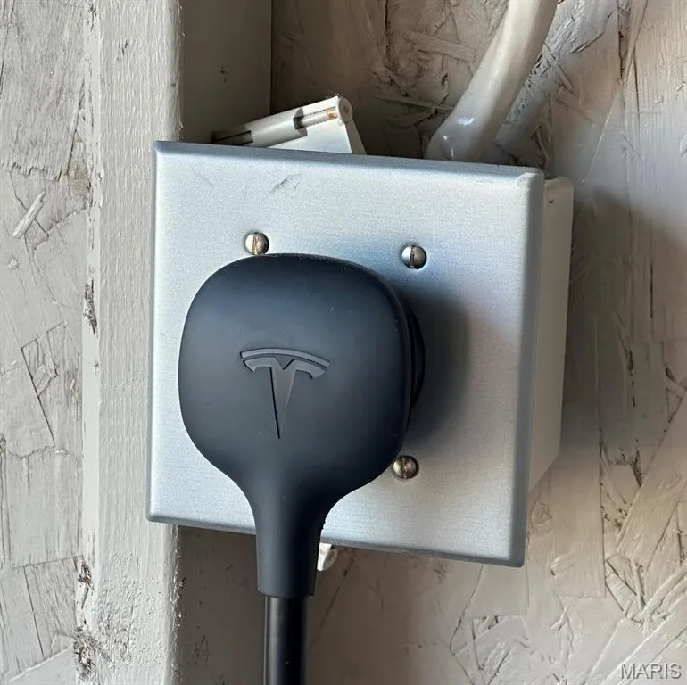 Electric vehicle charging port with a matte black connection — 110 Alta Mira Court, Dardenne Prairie, MO 63368